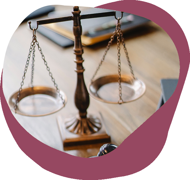 A bronze justice scale balanced equally on both sides.